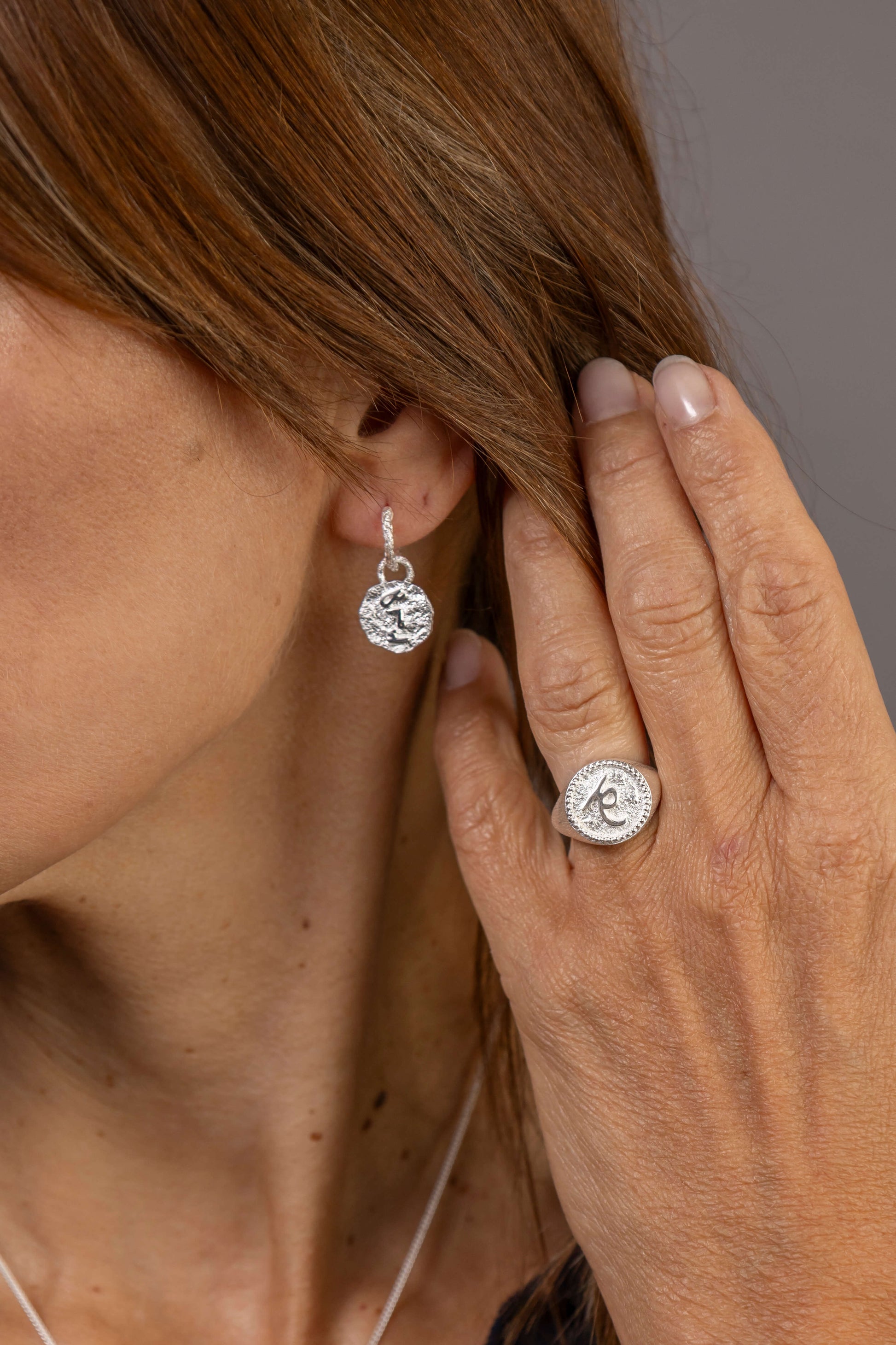 model wears F*** this Sh*t Silver Huggie Hoops