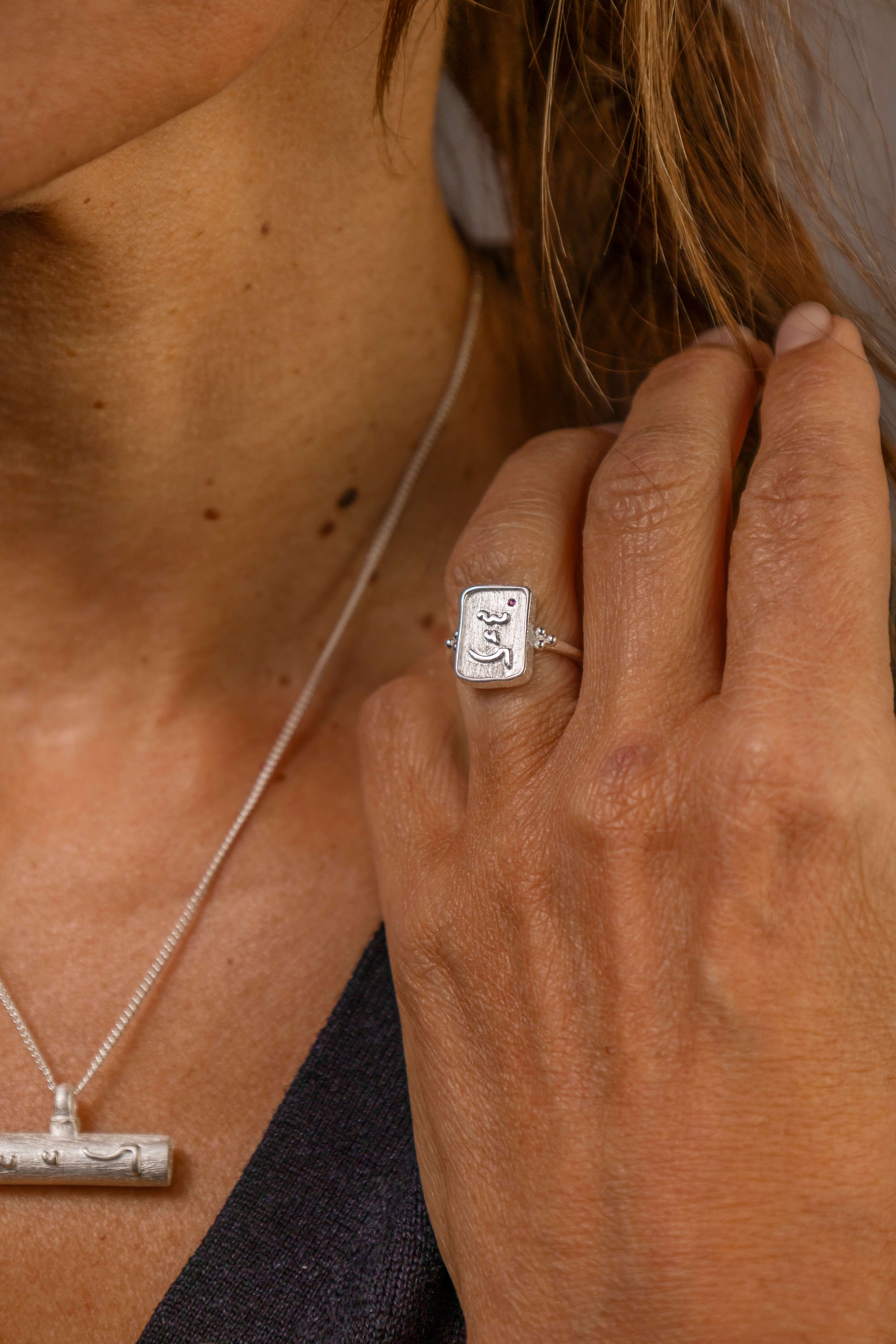 model wears Know Your Worth Silver Ring with ruby gemstone