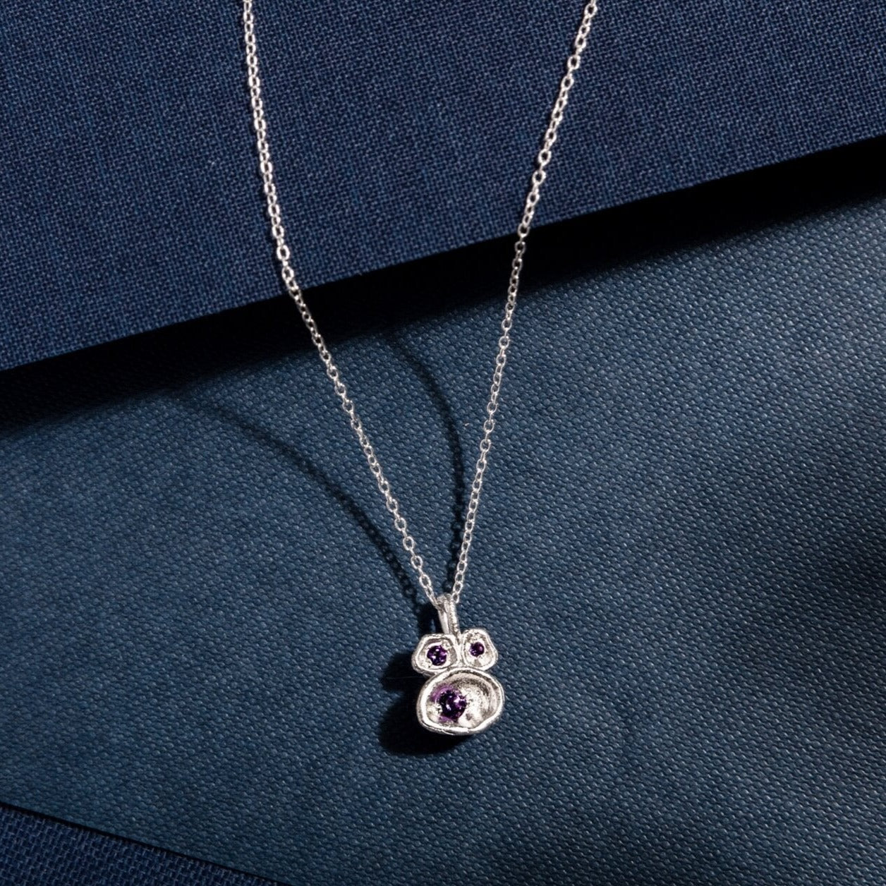  Analyzing image     silver-and-amethyst-lichen-drop-birthstone-necklace-claire-hill-designs