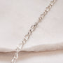 close up of figaro chain necklace silver