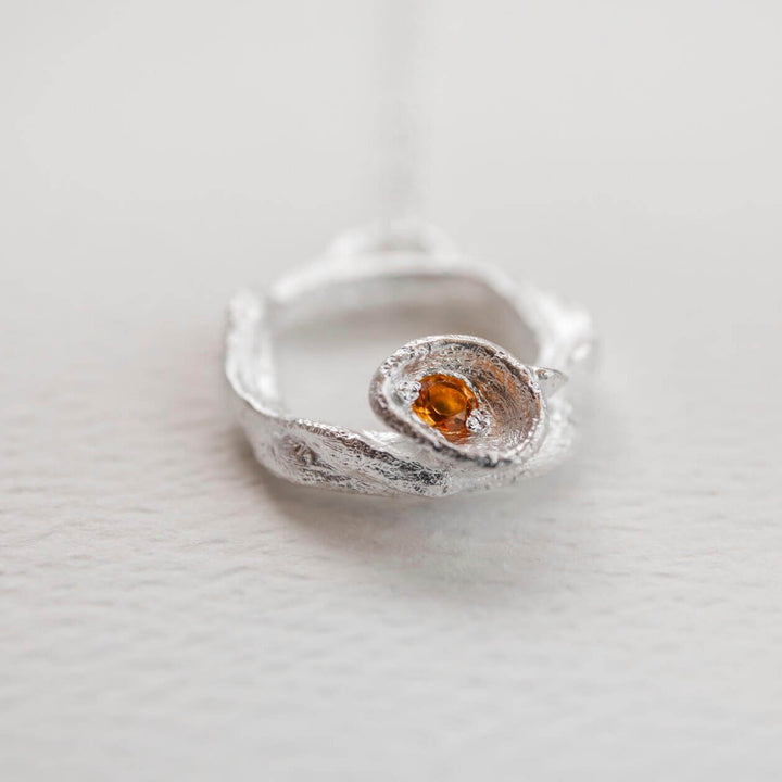 close up of  Silver and citrine gemstone birthstone large eternity necklace