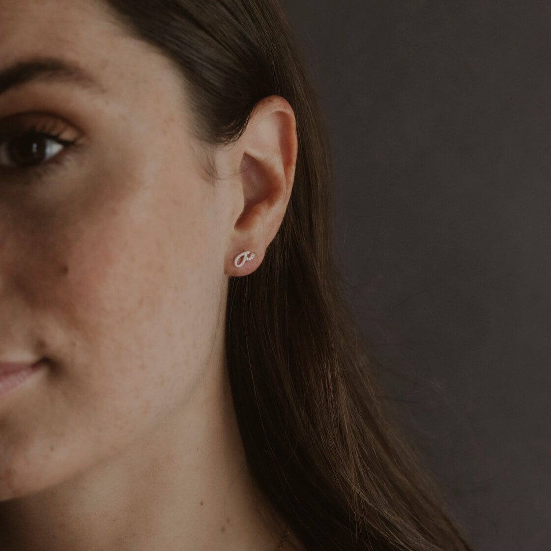 Model wears Silver Fuck Shorthand Stud Earring 