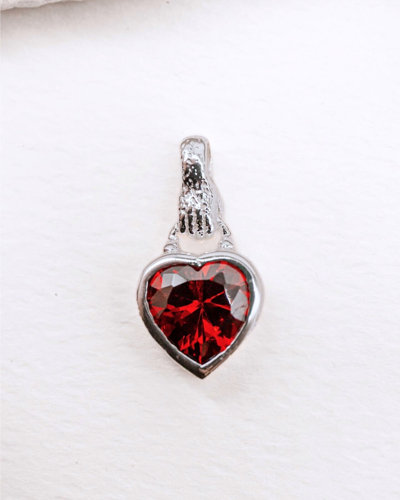 Garnet Heart in Hand Silver Charm Pendant