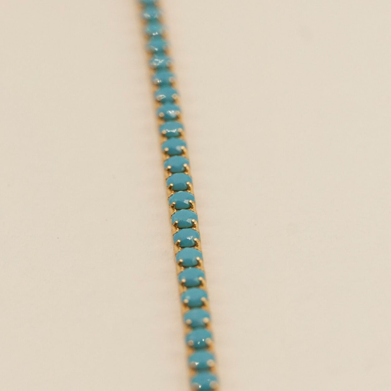 Close up of turquoise and 18k gold vermeil tennis bracelet 